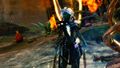 Branded Caithe standing in front of a burning sylvari building.